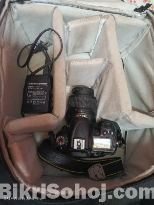 Nikon d7000 bodey lench and battery charger ,bag
